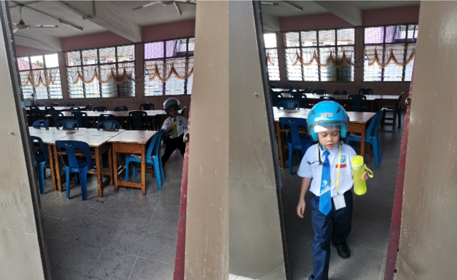 Fadliu00e2u20acu2122s son, Asyraff, quickly runs back out of class once retrieving his bottle. u00e2u20acu201d Picture via Facebook/Mohd Fadli Salleh. 