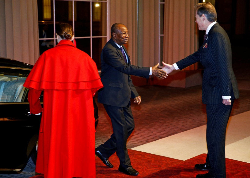 Guinea's President Alpha Conde (centre) arrives to attend a reception for heads of State and Government at Buckingham Palace in London on January 20, 2020. u00e2u20acu201d AFP pic
