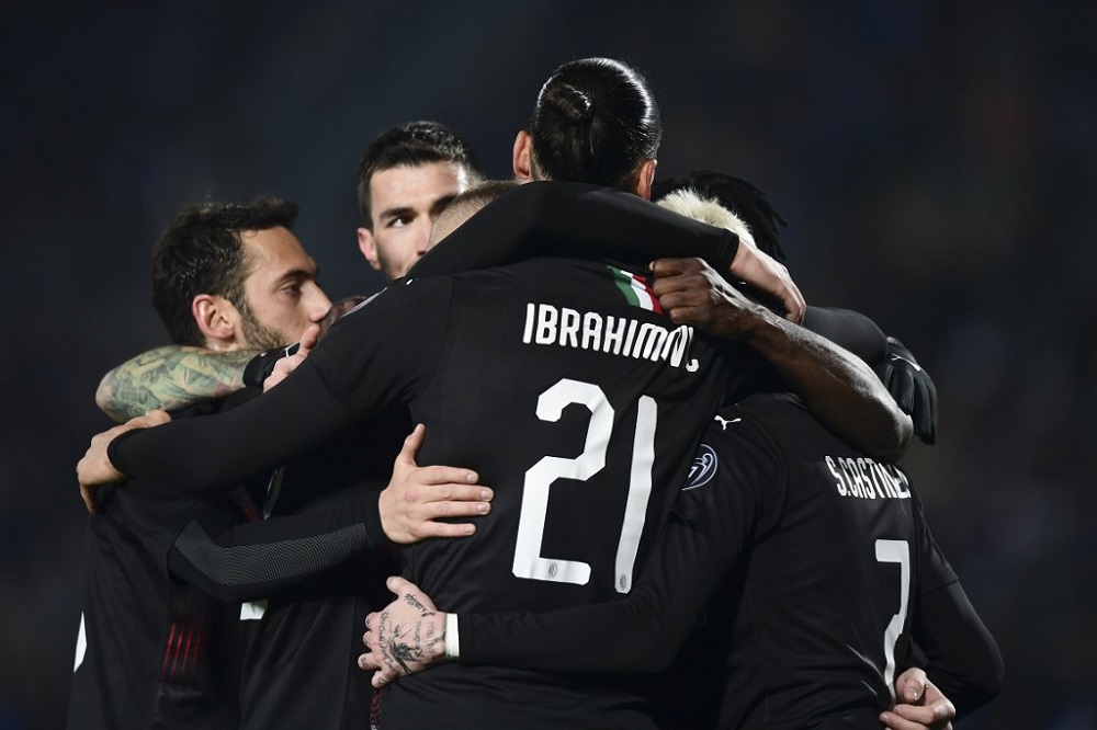 AC Milan's Ante Rebic (hidden) is congratulated by Zlatan Ibrahimovic (centre) and comrades during the Italian Serie A football match between Brescia and AC Milan at the Mario Rigamonti stadium in Brescia January 24, 2020. u00e2u20acu201d AFP pic