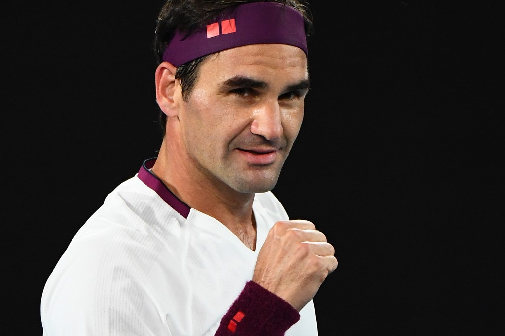 Switzerland's Roger Federer celebrates after victory against Hungary's Marton Fucsovics during their men's singles match on day seven of the Australian Open tennis tournament in Melbourne on January 26, 2020. — AFP pic