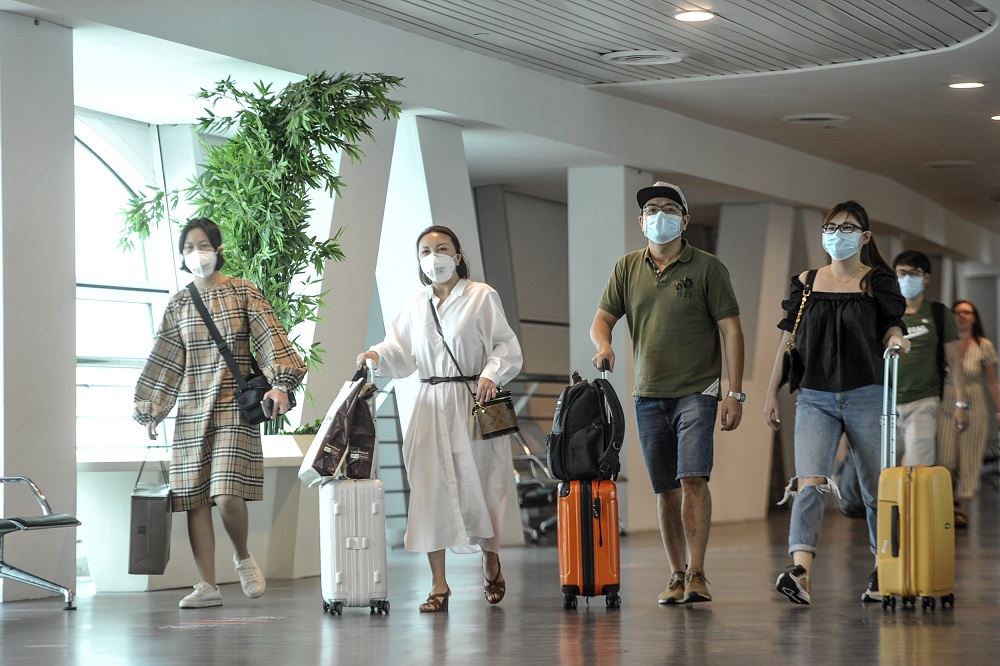 Tourists are seen wearing protective masks at the arrival hall in KLIA 2, Sepang January 27, 2020. u00e2u20acu201d Picture by Shafwan Zaidon