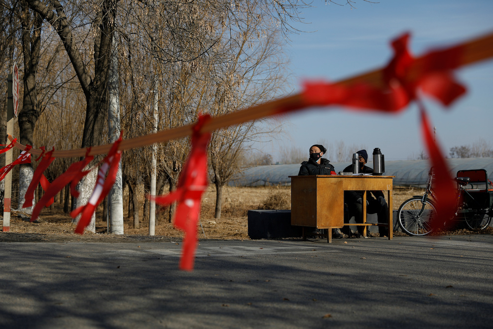 Community members guard at the entrance of a community to prevent outsiders from entering, as the country is hit by an outbreak of the new coronavirus, on outskirts of Beijing January 29, 2020. u00e2u20acu201d Reuters picnn