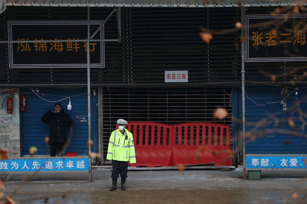 A police officer wearing a mask stands in front of the closed seafood market in Wuhan January 10, 2020. u00e2u20acu201d Reuters pic