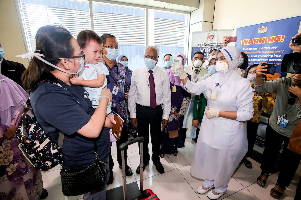 State Health, Consumers Affairs, Civil Society, National Integration and Human Resource Committee chairman A. Sivanesan (centre) checking the inspection done at the Sultan Azlan Shah Airport in Ipoh January 30, 2020. u00e2u20acu201d Picture by Farhan Najib