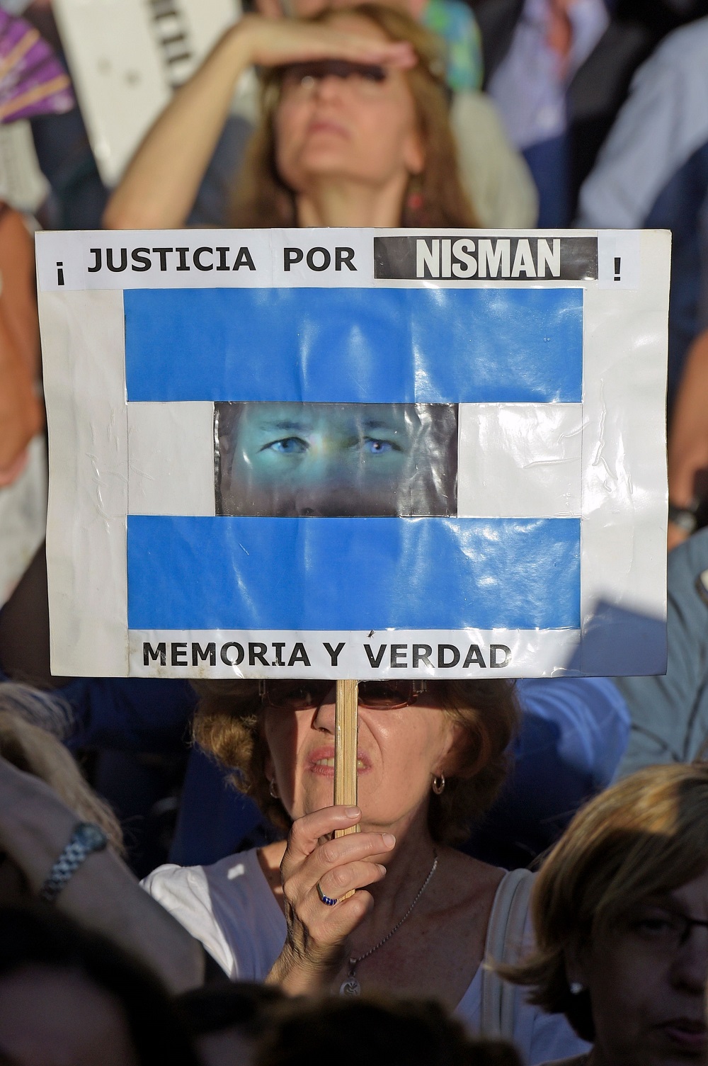 In this file photo taken on January 18, 2016, a woman holds a sign reading u00e2u20acu02dcJustice for Nisman! Memory and Truthu00e2u20acu2122 during a vigil on the first anniversary of Argentinian prosecutor Alberto Nismanu00e2u20acu2122s death in Buenos Aires. u00e2u20acu201d AFP pic  