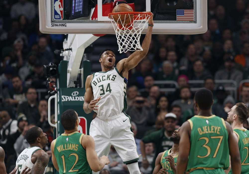 Milwaukee Bucks forward Giannis Antetokounmpo (34) makes a basket against the Boston Celtics during the second quarter at Fiserv Forum. u00e2u20acu2022 Jeff Hanisch-USA TODAY Sports pic via Reuters