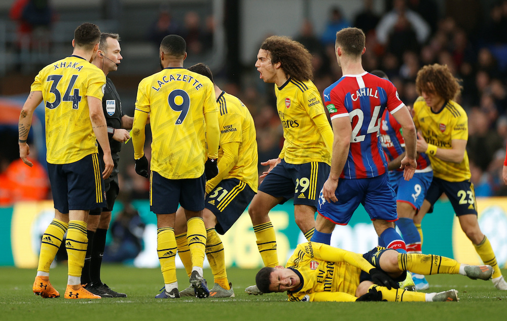 Arsenalu00e2u20acu2122s Matteo Guendouzi and teammates remonstrate with referee Paul Tierney as Arsenalu00e2u20acu2122s Gabriel Martinelli reacts after sustaining an injury during their match with Crystal Palace at Selhurst Park in London, January 11, 2020. u00e2u20acu2022 Reuters picnn