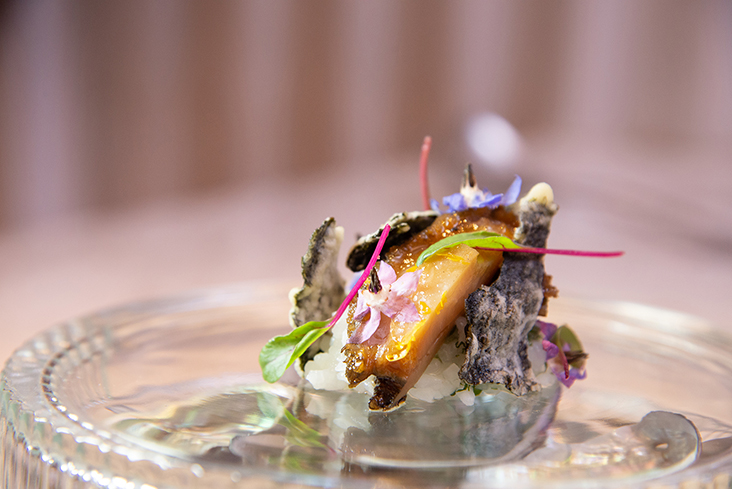 The charcoal grilled abalone served on pearl rice.