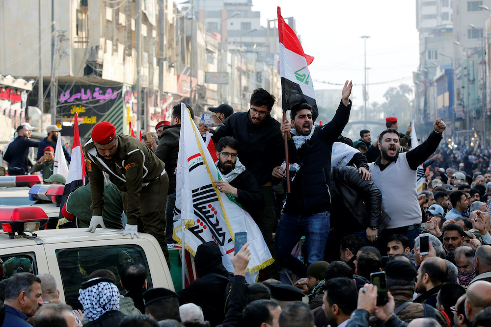 Mourners gesture as they attend the funeral of the Iranian Major-General Qassem Soleimani, top commander of the elite Quds Force of the Revolutionary Guards, and the Iraqi militia commander Abu Mahdi al-Muhandis, who were killed in an air strike at Baghda