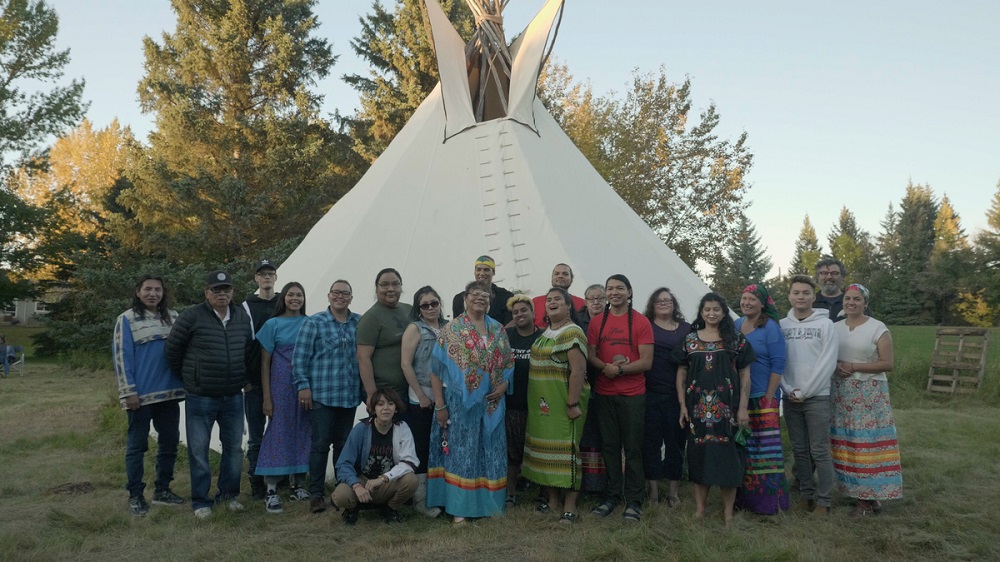 Attendees of a u00e2u20acu02dctwo-spirit sweatu00e2u20acu2122, a sacred, LGBT-inclusive Cree ceremony, pose for a photo outside a teepee in the garden of Dr James Makokis and Anthony Johnson's house, near Edmonton, Alberta, Canada September 21, 2019. u00e2u20acu201d Thomson Reuters Foundati