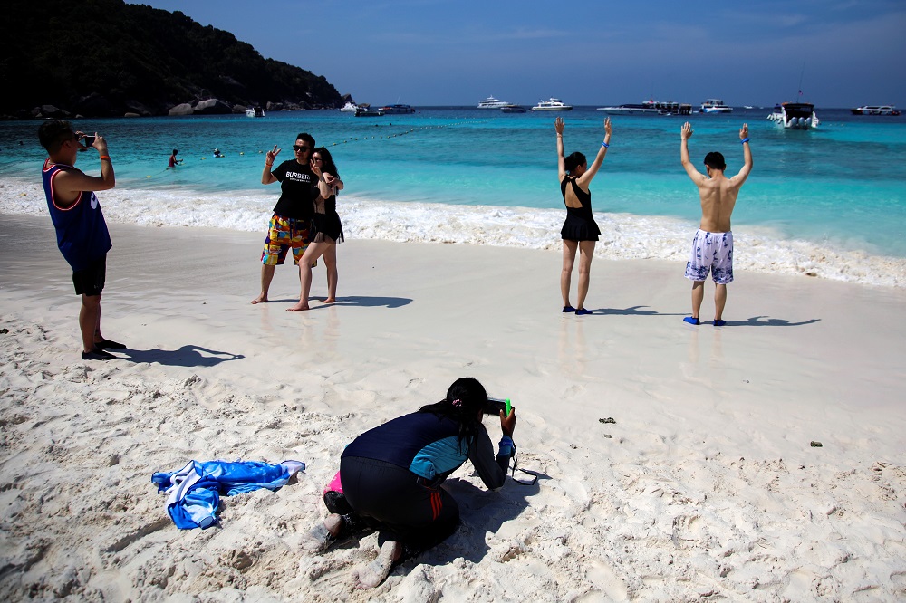 Chinese tourists pose on a beach at an island in Phang-Nga province, Thailand January 30, 2020. u00e2u20acu201d Reuters pic