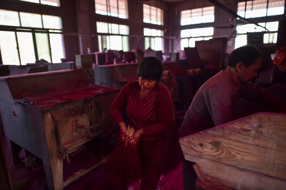 This photo taken on December 11, 2019 shows workers making incense sticks at the Fujian Xingquan Incense Factory in the city of Quanzhou in China’s Fujian Province. — AFP pic