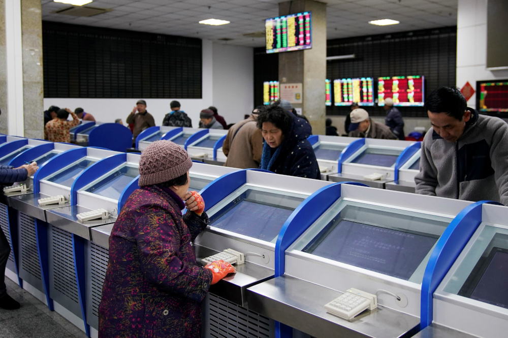 Investors look at computer screens showing stock information at a brokerage house in Shanghai, China January 16, 2020. u00e2u20acu201d Reuters pic