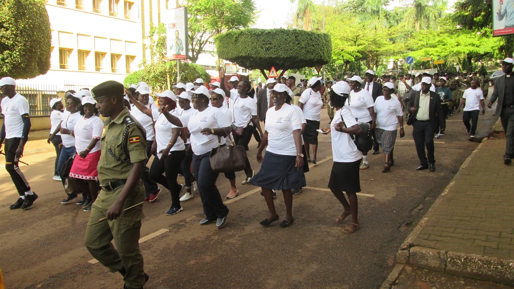 A group from the Walkers Association of Uganda raises awareness about climate change in Kampala, Uganda November 13, 2019. u00e2u20acu201d Thomson Reuters Foundation pic