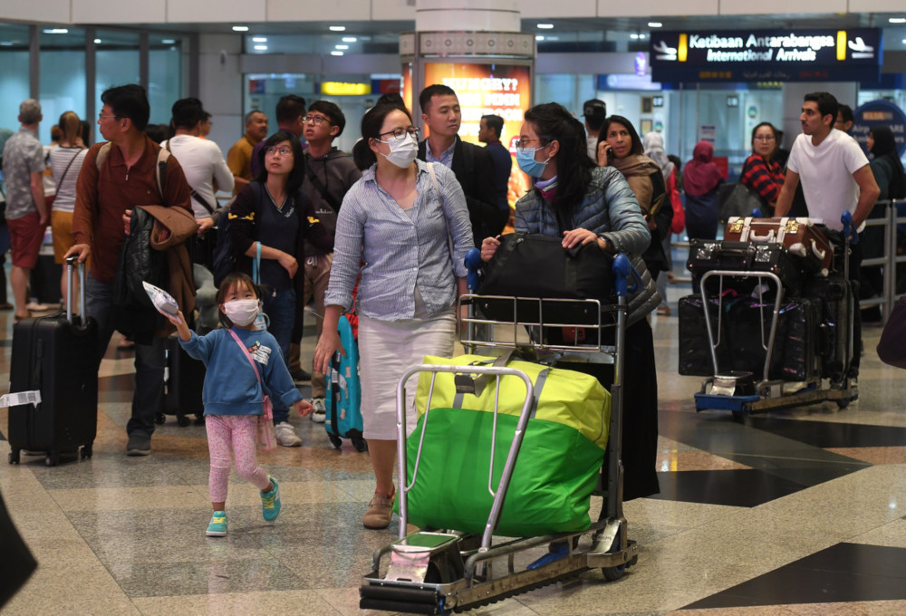 nA family wears face masks at the arrival hall of the Kuala Lumpur International Airport January 24, 2020. u00e2u20acu201d  Bernama pic n