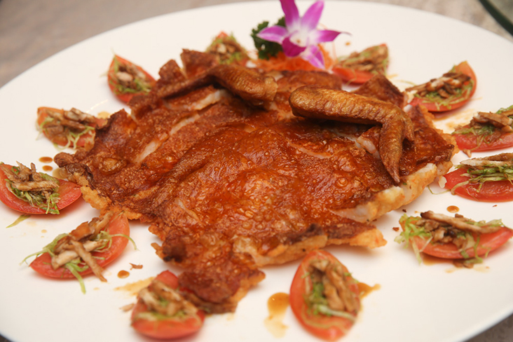 Dedication to perfection: It took them two years to perfect and elevate this golden boneless stuffed chicken with chicken tomato salad 