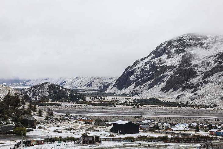 Turn back and see the town disappearing in the distance, swallowed by the mountains and mists.