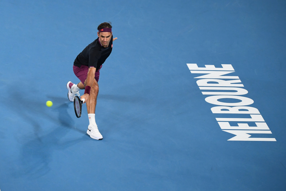 Switzerlandu00e2u20acu2122s Roger Federer hits a return against Steve Johnson of the US during their menu00e2u20acu2122s singles match on day one of the Australian Open tennis tournament in Melbourne January 20, 2020. u00e2u20acu201d AFP pic 