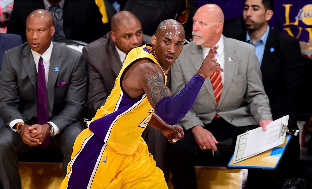 Fans celebrate as Kobe Bryant of the Los Angeles Lakers reacts after scoring against the Los Angeles Lakerson at Staples Centre in Los Angeles April 6, 2016. u00e2u20acu201d AFP pic