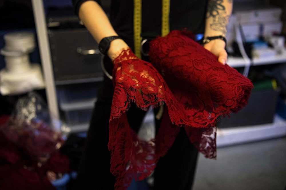 French lingerie designer Paloma Casile shows lace fabric at her workshop in Paris January 13, 2020. — AFP pic