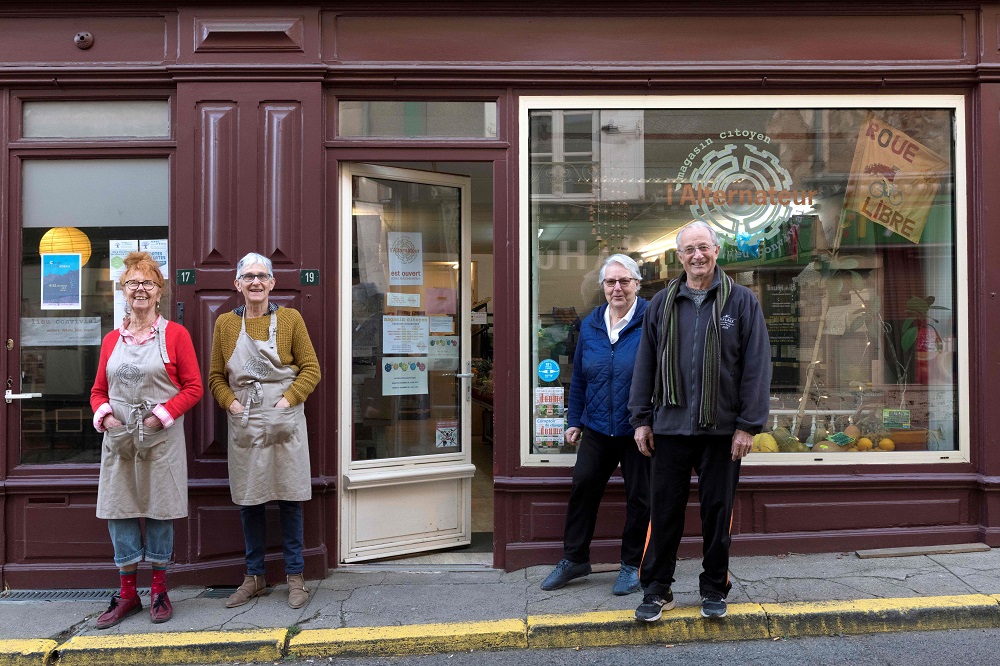 Volunteers pose in front of lu00e2u20acu2122Alternateur, the last grocery store of Sauxillanges village in the Puy de Dome region, central France January 2, 2020. u00e2u20acu201d AFP pic 