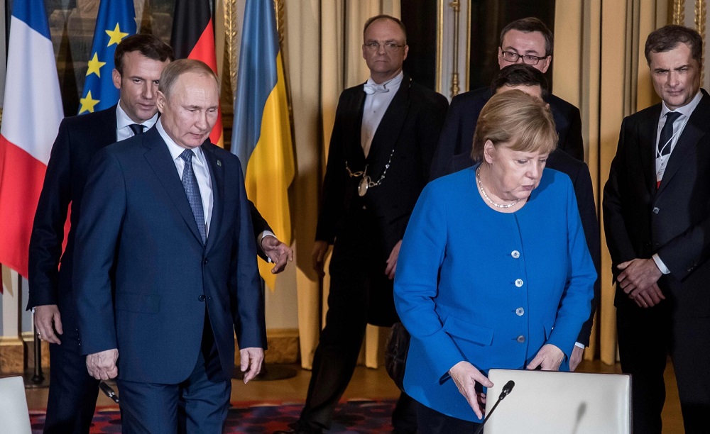 (From left) French President Emmanuel Macron, Russian President Vladimir Putin, German Chancellor Angela Merkel and Ukrainian President Volodymyr Zelensky (hidden) arrive for a meeting in Paris December 9, 2019. u00e2u20acu201d AFP pic