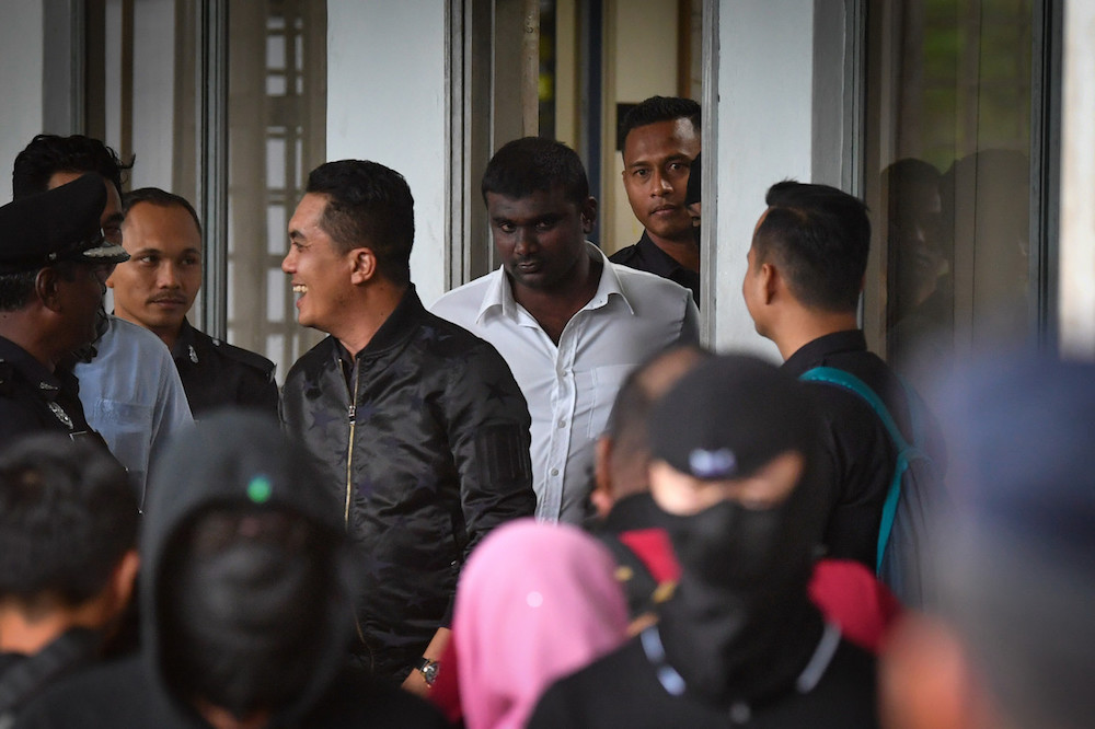 Gadek assemblyman G. Saminathan (white shirt) is seen at the Ayer Keroh Sessions Court in Melaka December 18, 2019. u00e2u20acu201d Bernama pic