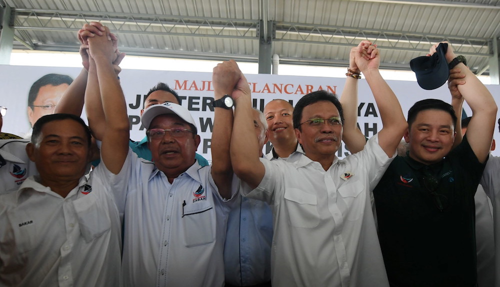 Sabah Chief Minister Datuk Seri Mohd Shafie Apdal and Datuk Karim Bujang pose for pictures in Kimanis January 2, 2020, after the latter was announced as Warisanu00e2u20acu2122s candidate for the Kimanis by-election. u00e2u20acu201d Bernama pic