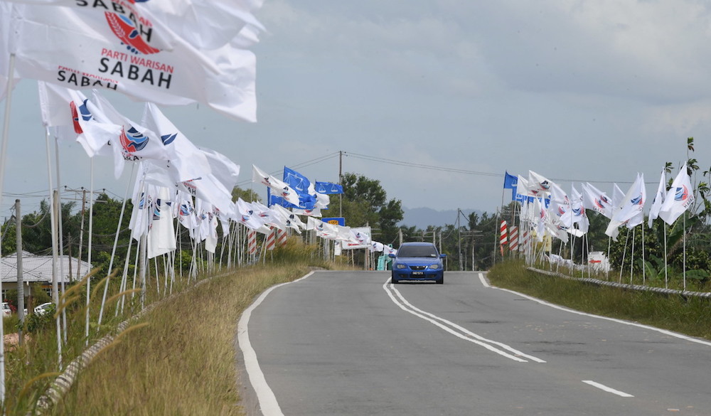 Party flags line the Membakut-Bengawan road January 5, 2020 ahead of the Kimanis by-election on January 18. u00e2u20acu201d Bernama pic