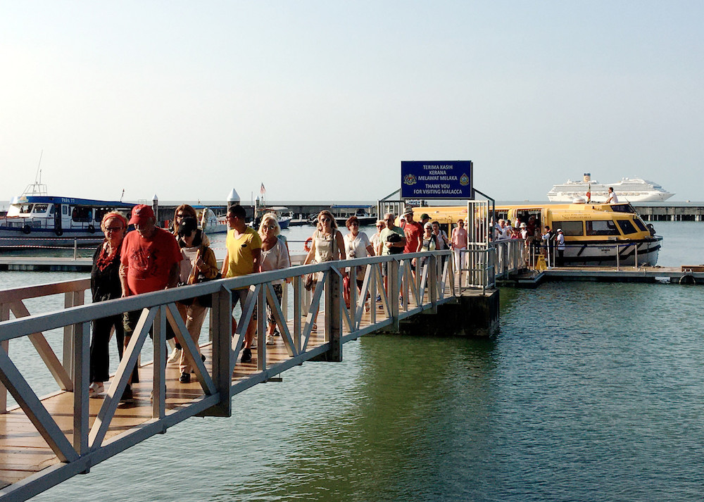 Tourists disembark a boat at Melaka Marina jetty November 13, 2019. u00e2u20acu201d Bernama pic