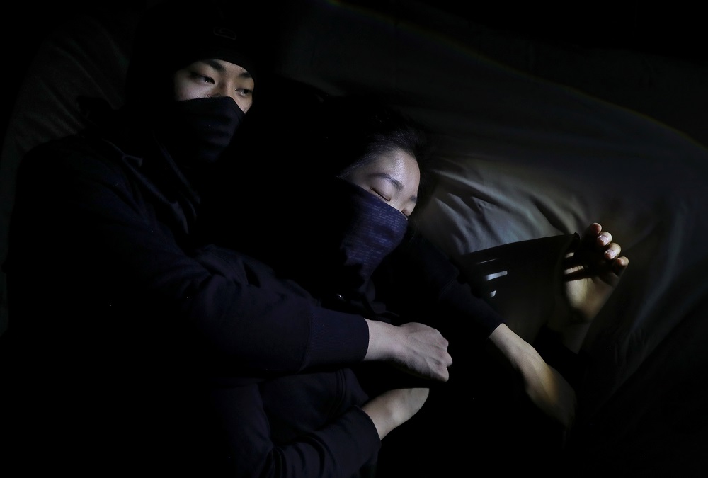 Front-line protesters Wing, 18, and Tony, 18, pose for a portrait in Hong Kong December 9, 2019. u00e2u20acu201d Reuters pic