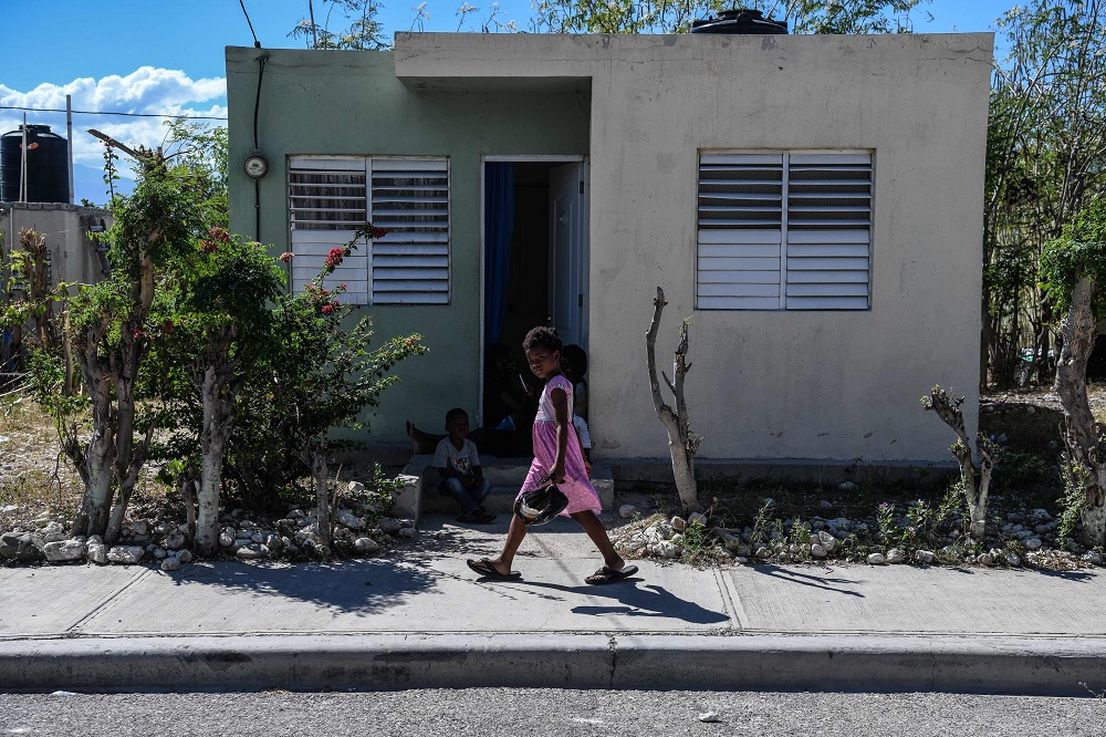 A girl walks in Croix des Bouquets, 12.9km to the northeast of Port-au-Prince, Haiti December 30, 2019. u00e2u20acu201d AFP