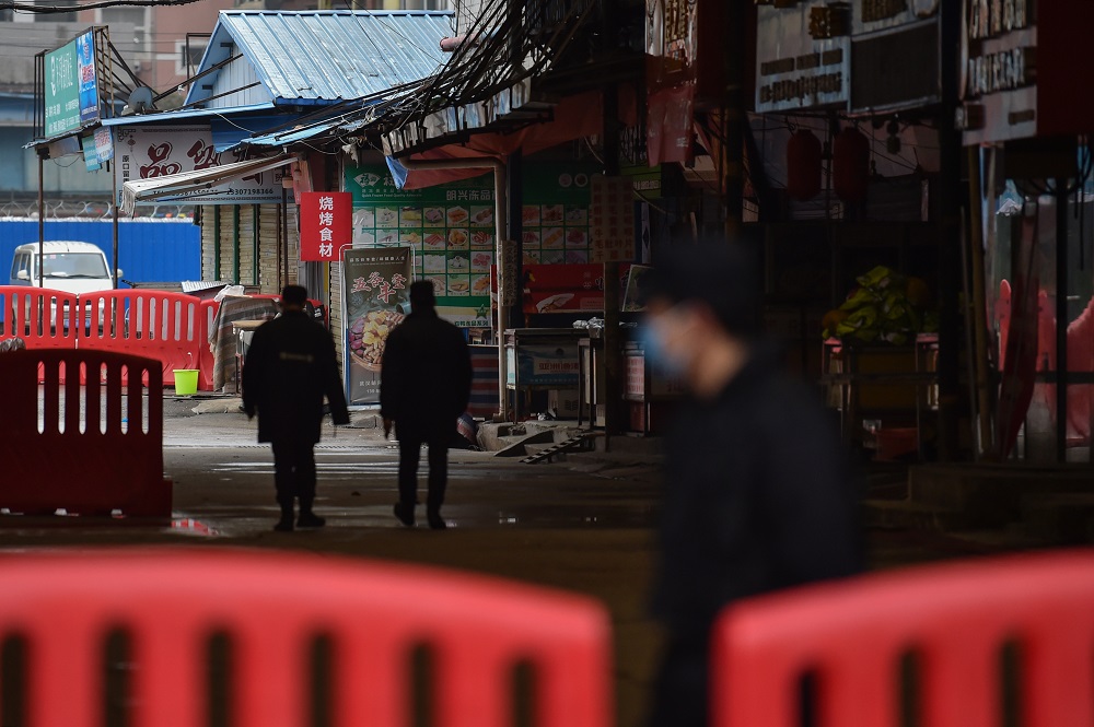 Security guards patrol outside the Huanan Seafood Wholesale Market where the coronavirus was detected in Wuhan, China January 24, 2020. u00e2u20acu201d AFP pic