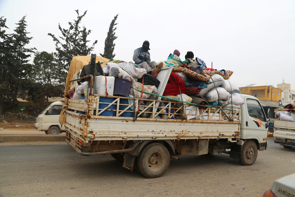 Trucks carry belongings of people fleeing from Maarat al-Numan, in northern Idlib, Syria December 24, 2019. u00e2u20acu2022 Reuters pic