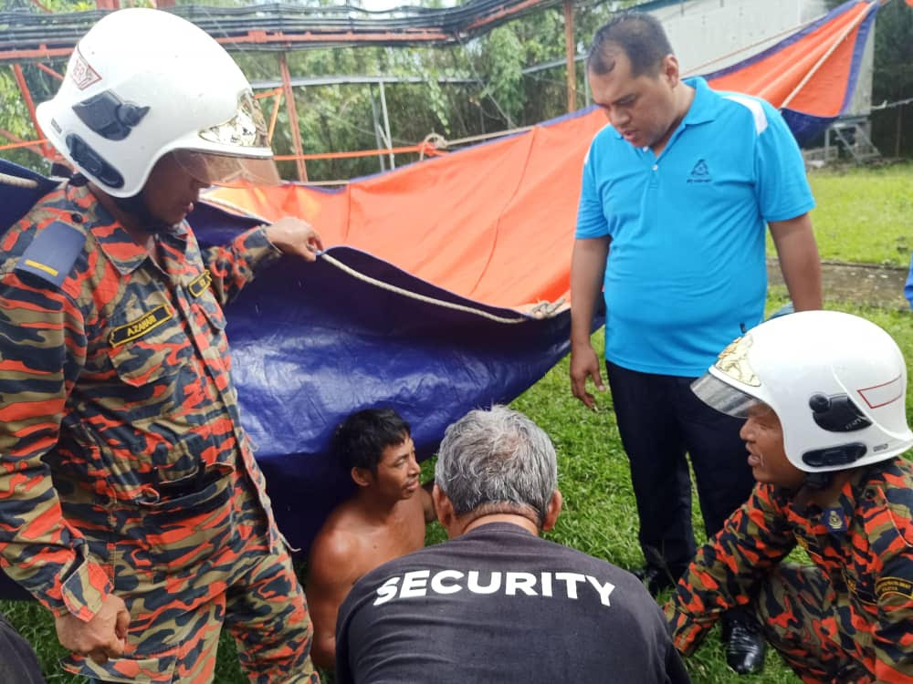The Indonesian national identified as Fandy in Bujang is given assistance after he was brought down from a telecommunications tower in Sibu January 21, 2020. u00e2u20acu201dPicture courtesy of the Kanowit Fire Department