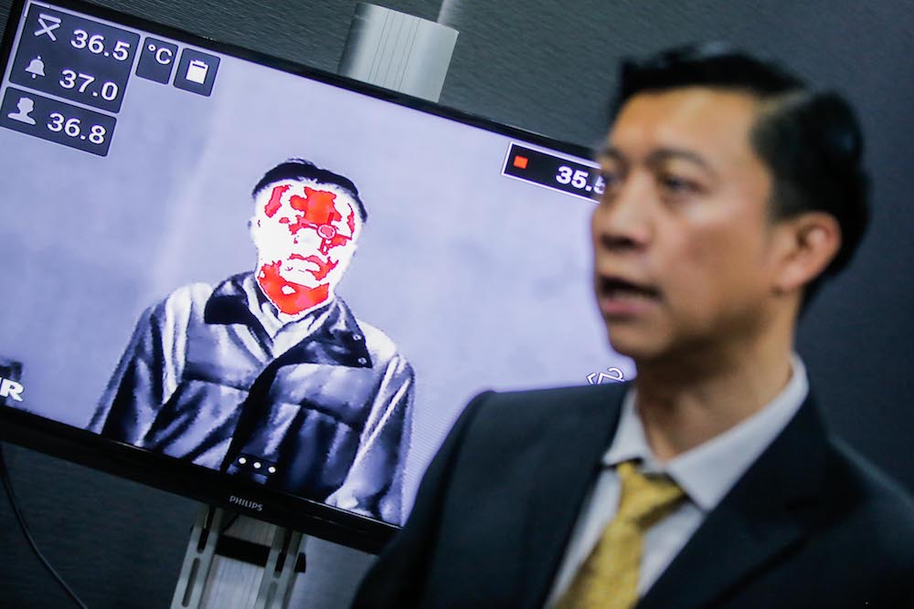 Inframatrix managing director Richard Lee explains how a thermal imaging camera works at his office in Cheras January 31, 2020. u00e2u20acu201d Picture by Hari Anggara