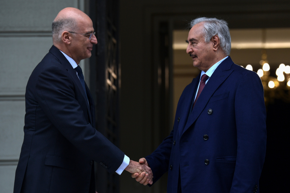 Greek Foreign Minister Nikos Dendias (left) welcomes Libyan strongman Khalifa Haftar before talks in Athens, January 17, 2020. u00e2u20acu201d AFP pic  