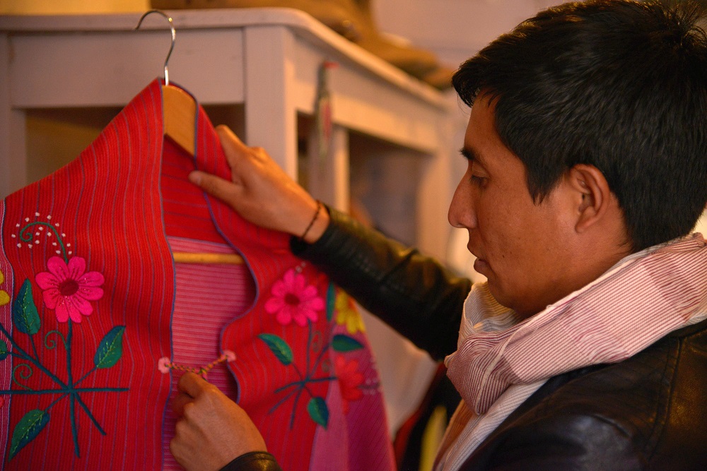 Alberto Lopez, an indigenous Mexican weaver and fashion designer who makes traditional garments with elaborately-embroidered patterns, checks a blouse at his store in San Cristobal de las Casas, in Chiapas state, Mexico January 15, 2020. u00e2u20acu2022 Reuters pic