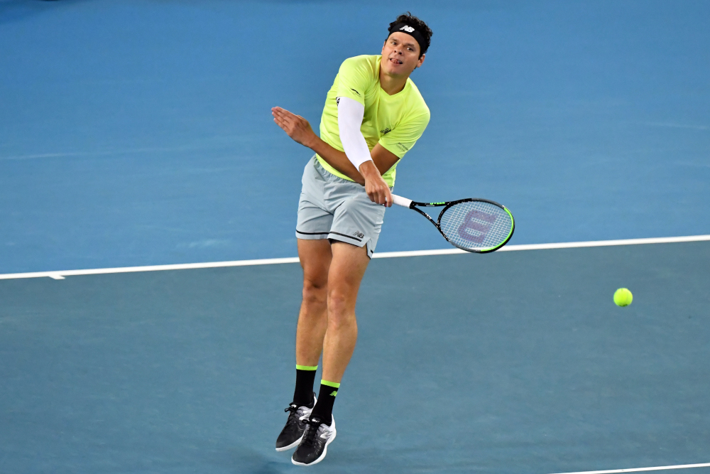 Canadau00e2u20acu2122s Milos Raonic hits a return against Greeceu00e2u20acu2122s Stefanos Tsitsipas during their menu00e2u20acu2122s singles match on day five of the Australian Open tennis tournament in Melbourne January 24, 2020. u00e2u20acu201d AFP pic 