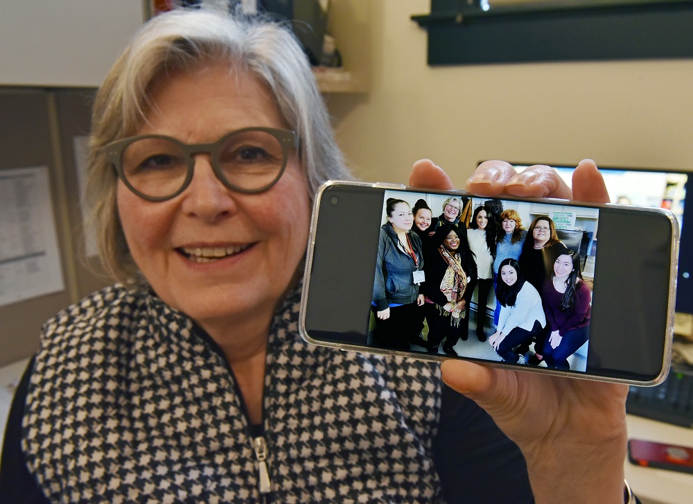Kate Gibson, acting executive director Downtown Eastside Women's Centre, posses with the photo taken with Meghan Markle, Duchess of Sussex, during a visit to the centre, in Vancouver January 15, 2020. u00e2u20acu2022 AFP pic