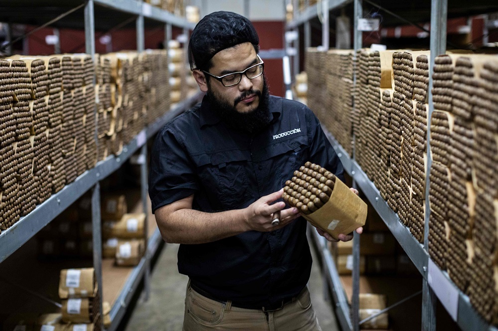 A worker of Nicaragua American Cigars Tobacco Factory checks the cigar’s quality in Esteli, Nicaragua January 22, 2020. — AFP pic  