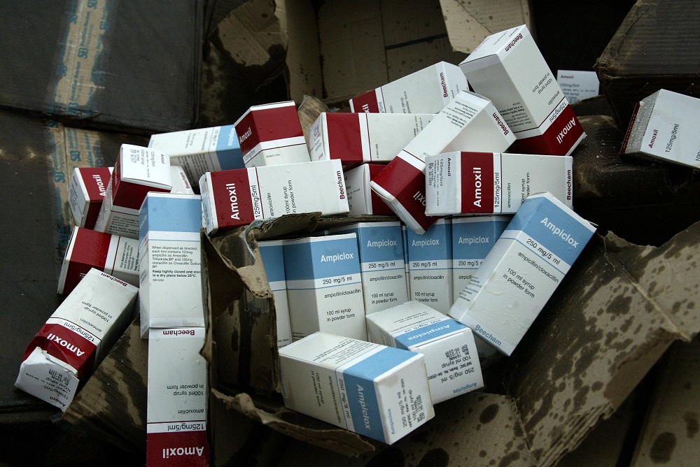 This file picture taken on November 1, 2007 at Shagamu dump site in Ogun State, southwest Nigeria shows seized cartons of fake drugs to be set ablaze by officials of the National Agency for Food and Drug Administration and Control (NAFDAC). u00e2u20acu201d AFP pic  