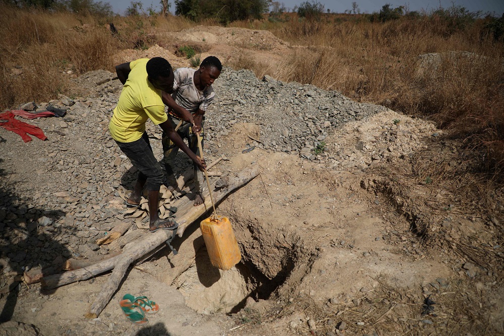 Miners work at a mining site in Anka near Gusau, Nigeria December 4, 2019. — AFP pic