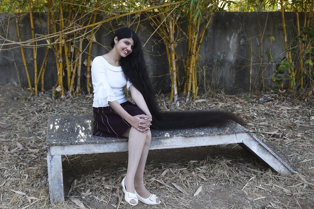 Nilanshi Patel, 17, who has been awarded the 2019 Guinness World Record for the longest hair in the teenager category, 190 cm, poses for a picture at Modasa town, some 110km from Ahmedabad on January 19, 2020. u00e2u20acu201d AFP pic