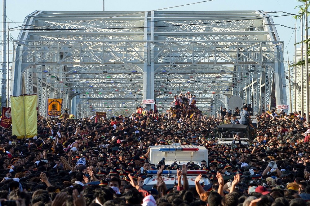 Devotees gather to see the Black Nazarene statue during the annual religious procession in Manila January 9, 2020. — AFP pic