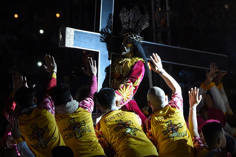 Devotees try to touch the Black Nazarene statue during the annual religious procession in Manila January 9, 2020. u00e2u20acu201d AFP pic