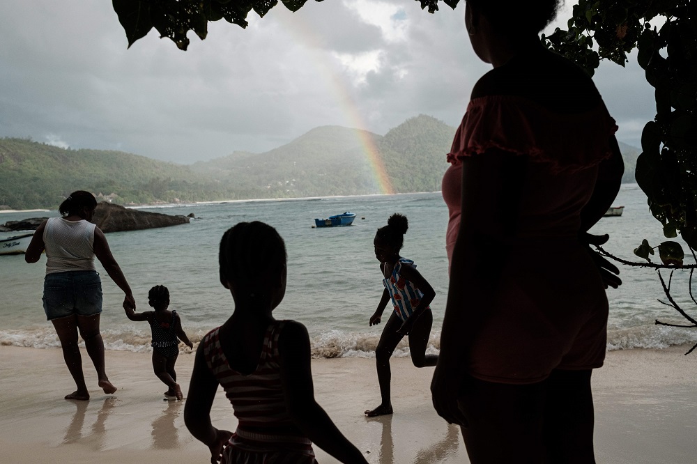 A picture taken on November 17, 2019, shows Seychellois enjoy their family picnic at a beach in Mahe island, the largest island contains the capital city of Victoria, Seychelles. u00e2u20acu2022 AFP pic  