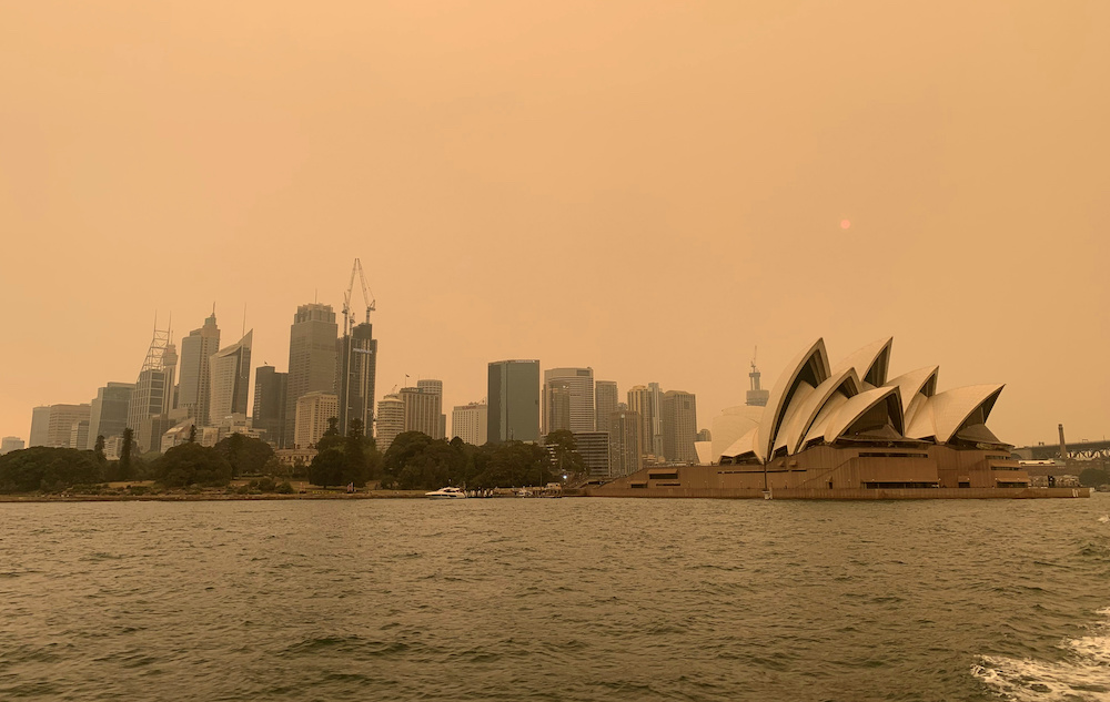 Haze from bushfires obscures the sun setting above the Sydney Opera House in Sydney, Australia, December 6, 2019. — Reuters pic