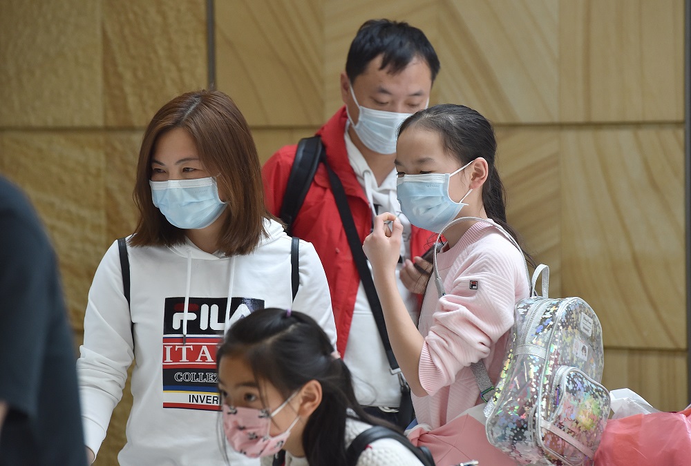 A family at Sydney airport after landing on a plane from the Chinese city of Wuhan January 23, 2020. u00e2u20acu201d AFP pic