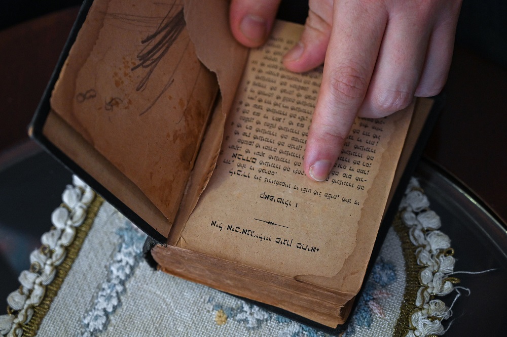 In this photograph taken on December 8, 2019, 30 year-old Can Evrensel Rodrik who was taught Judeo-Spanish when he was a child by his grandmother, shows a book written in Judeo-Spanish during an interview with AFP in Istanbul. u00e2u20acu201d AFP pic  